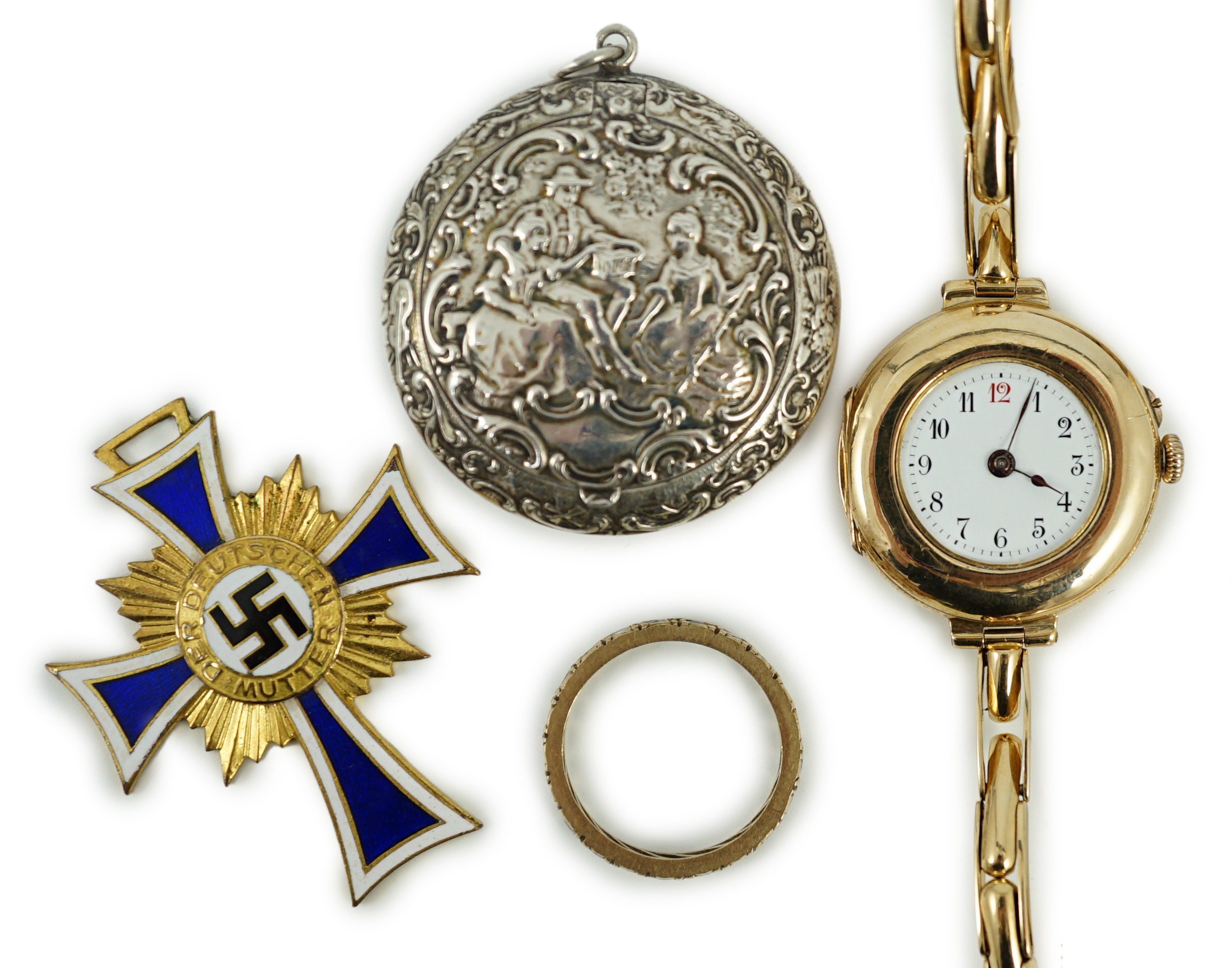 An early 20th century 9ct gold manual wind wrist watch, on a 15ct expanding bracelet, case diameter 28mm, gross weight 25.3 grams, a yellow metal and simulated diamond set eternity ring, A 1930's German git and enamel cr